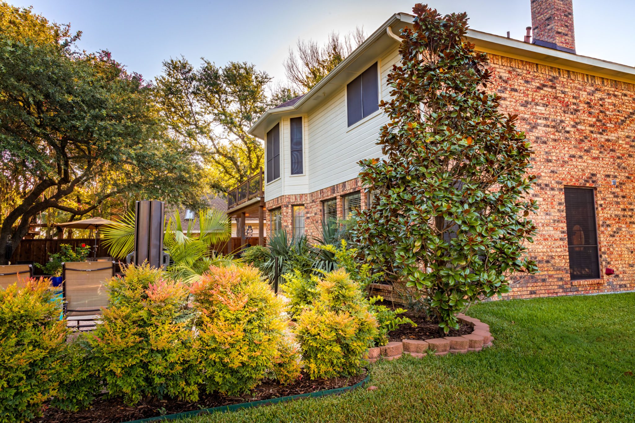 Two-story home surrounded by trees